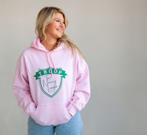 The Nanny League girl scout troop themed sweatshirt. Pink with green troop/The Nanny League shield